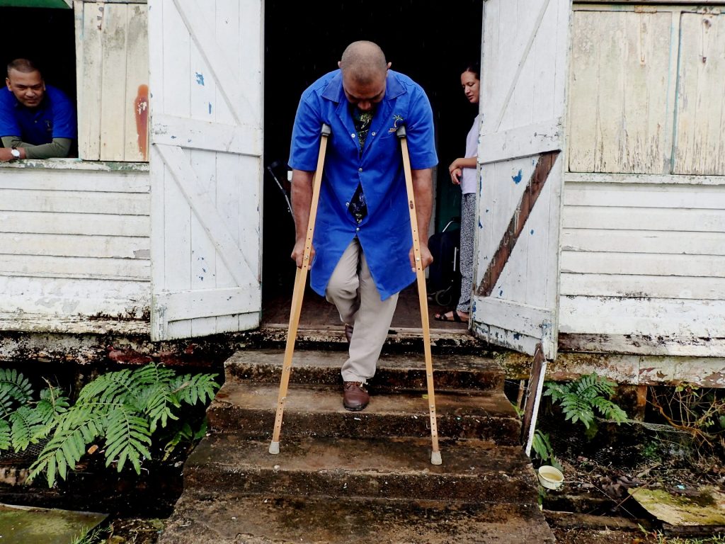 Using axilla crutches on a set of stairs