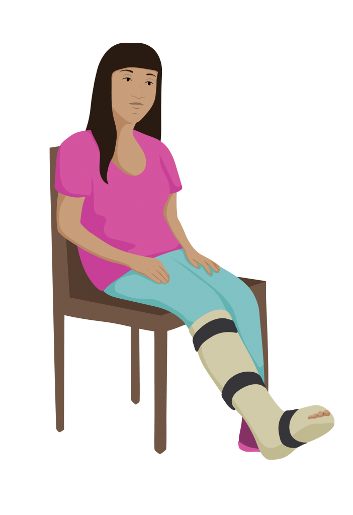 Adira seated with cast on her right leg