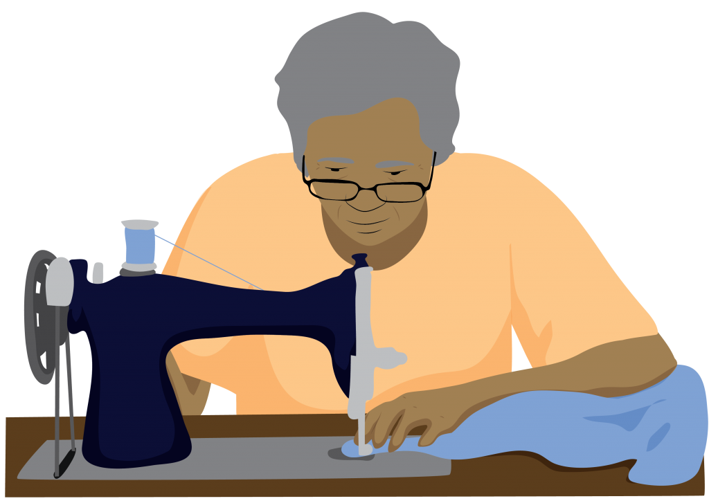 Malik with reading glasses at sewing machine