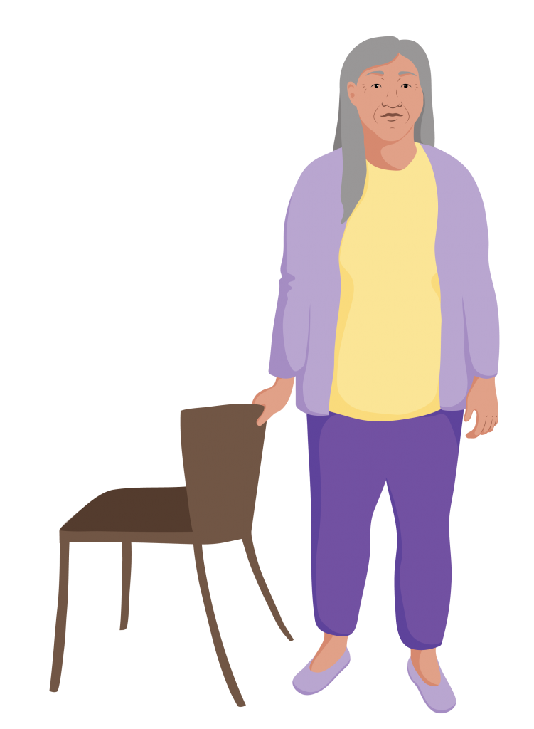 Nguyen standing, holding onto a chair