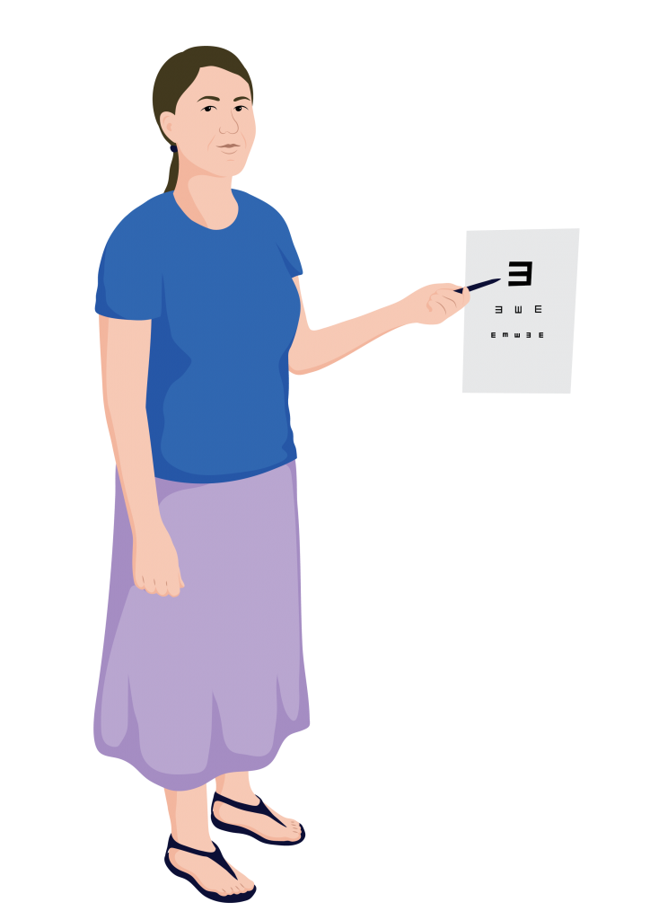 A service provider standing next to E-Chart on the wall, gesturing to the large E with a pen.