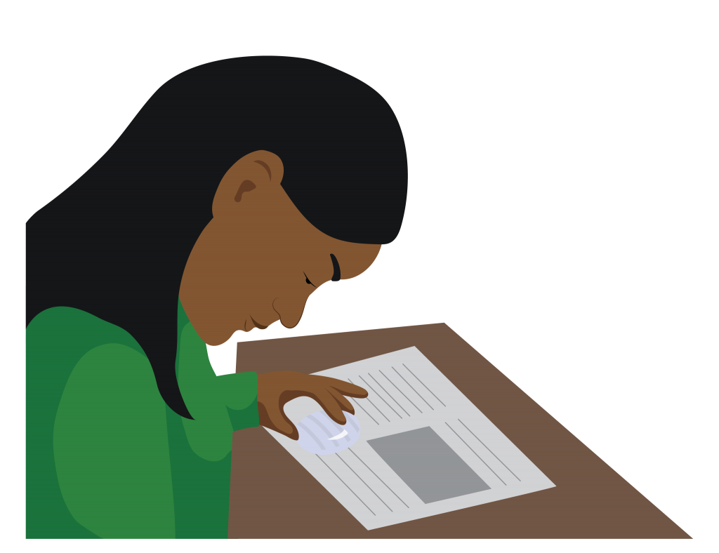 Person using a dome magnifier to read.