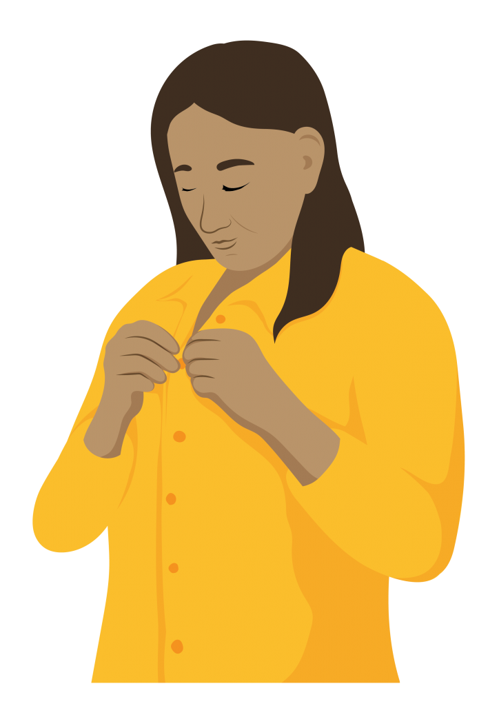 A woman uses both hands to button the top of her shirt.