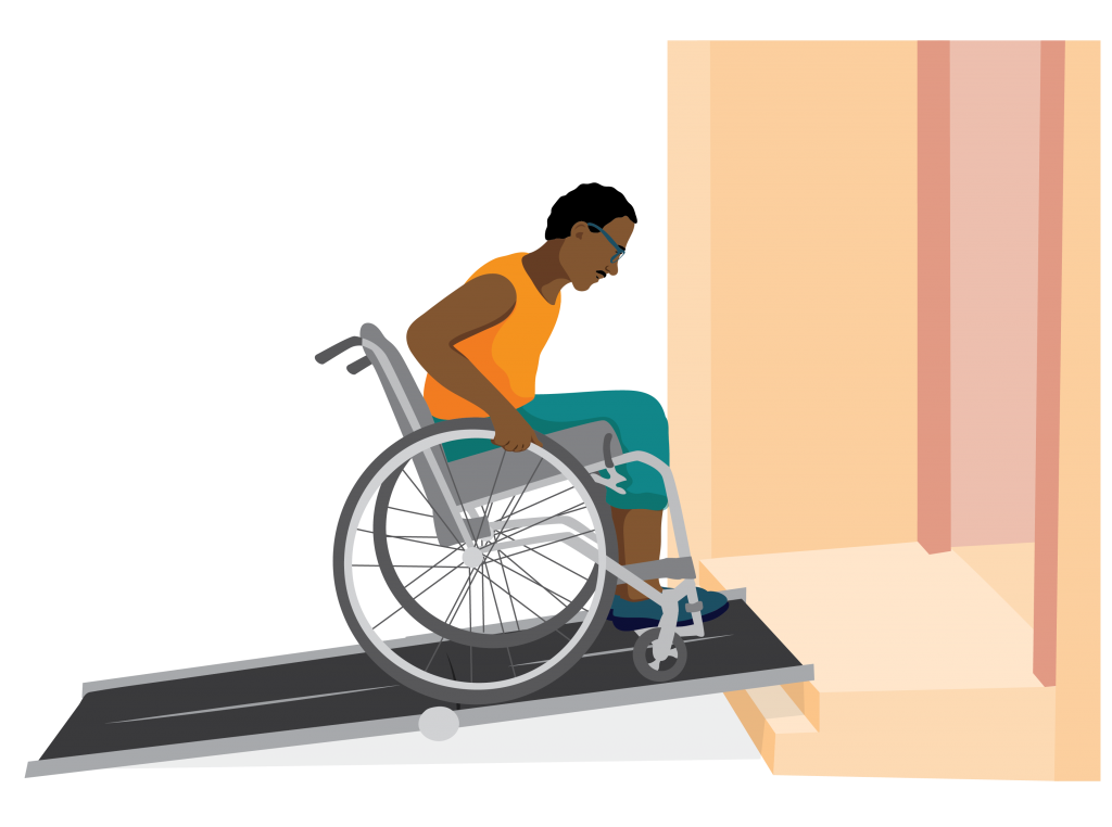 Peter uses his wheelchair to go up a ramp placed over stairs.