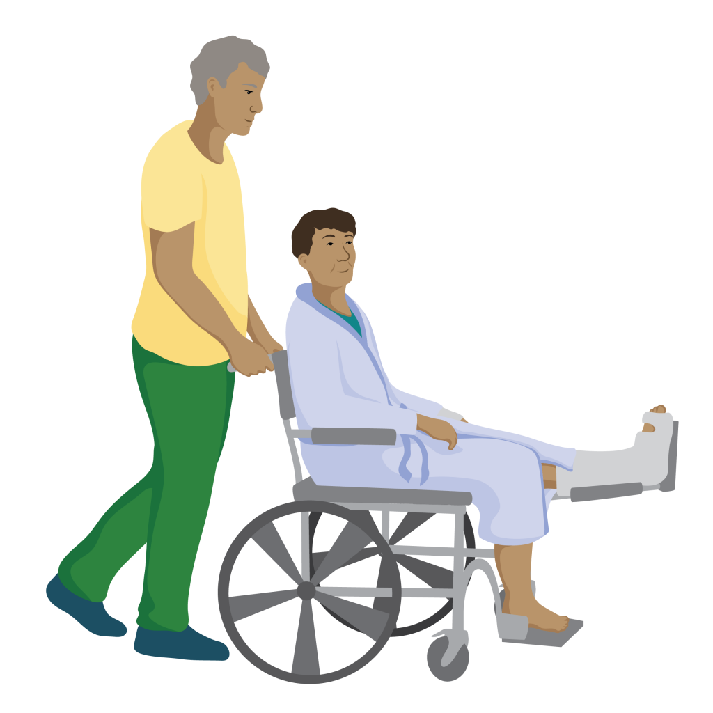 Ronin sits in a wheelchair with his broken leg on a leg rest in front of him. He is being pushed by an older man.