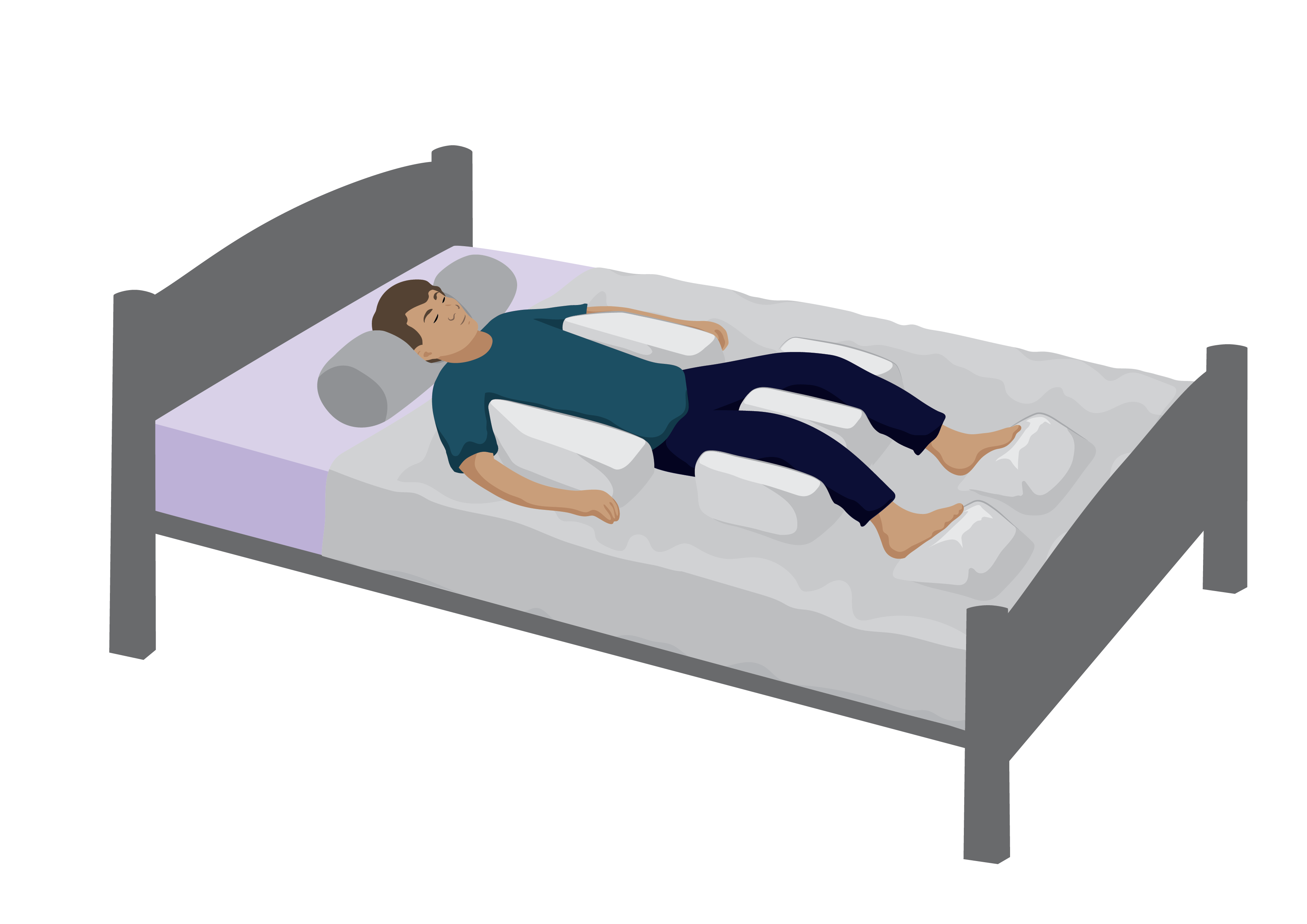 A man lying on a bed with pillow supports around his body.