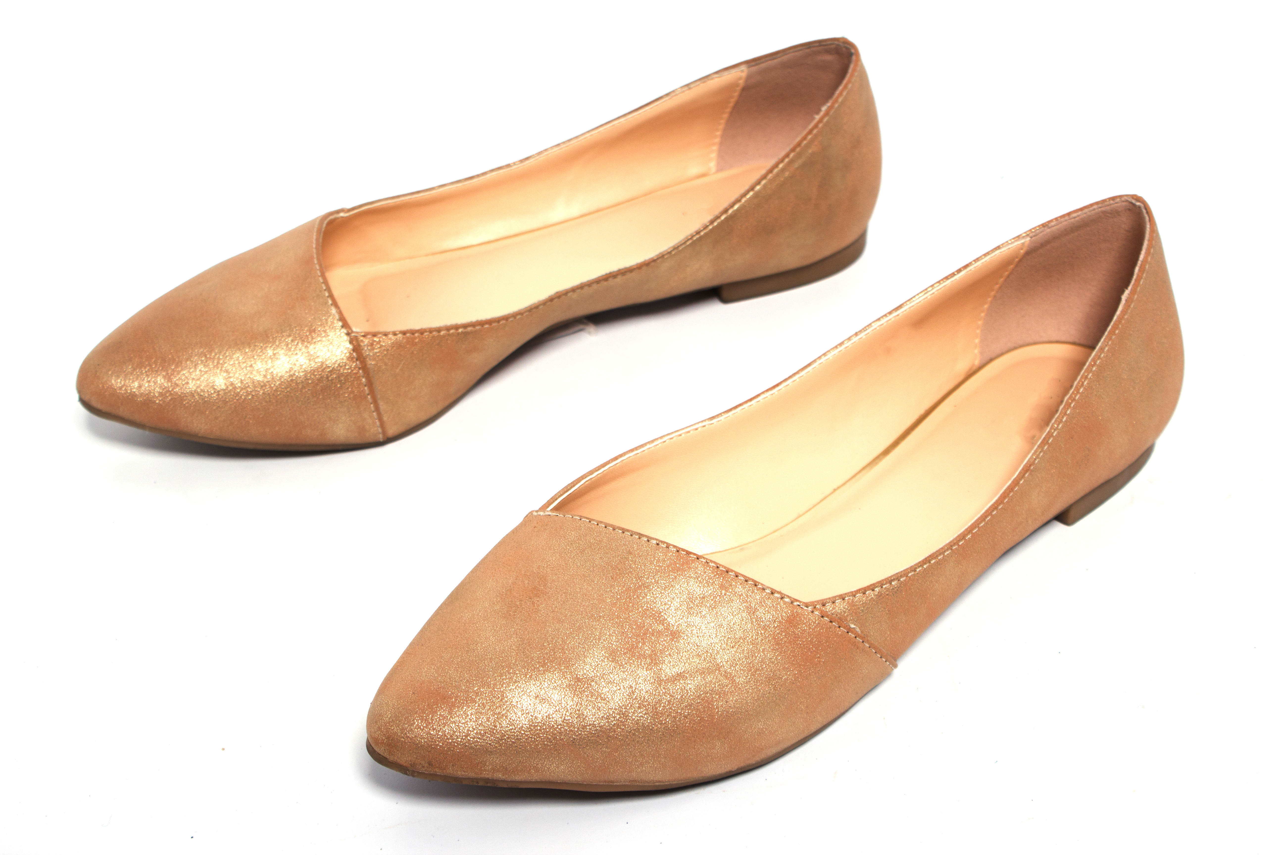 A pair of flat shoes that only over the toes, which are pointed. The base is very thin with a small heel.