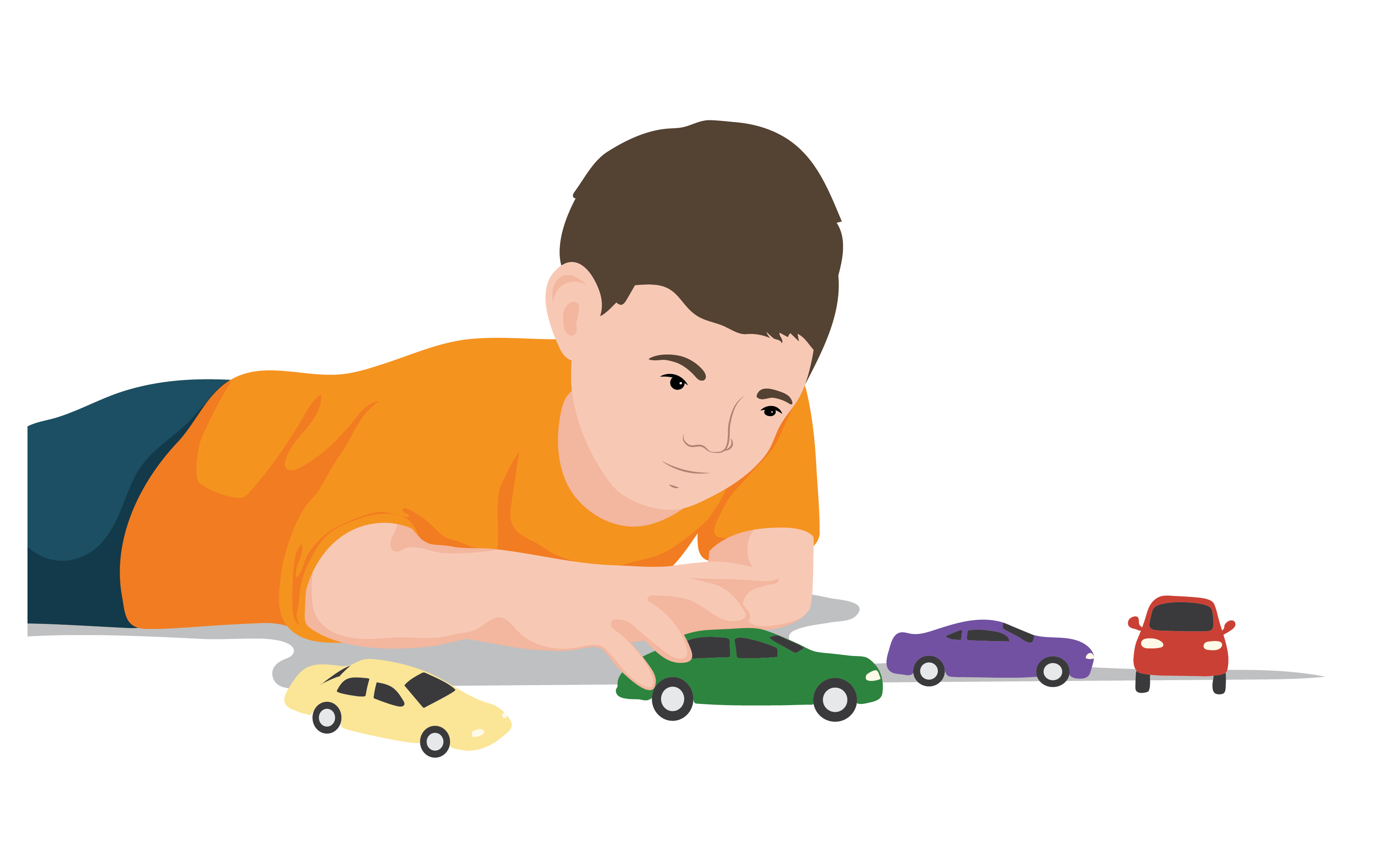 A young boy lays the floor playing with toy cars.