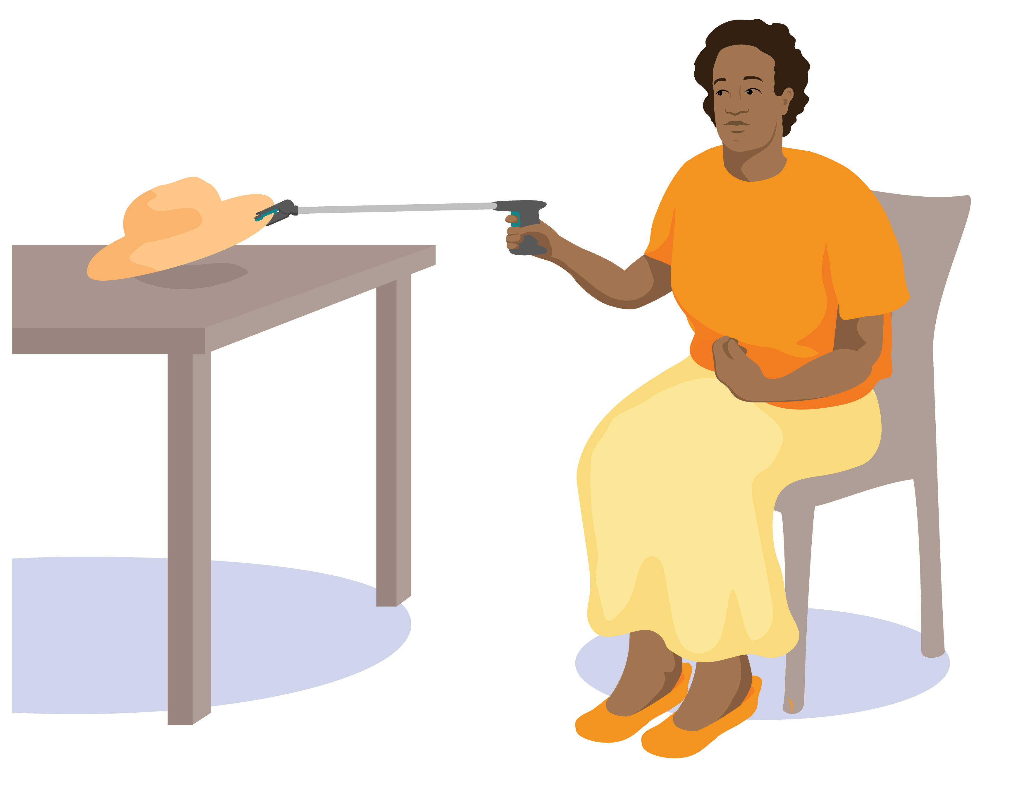 A person uses a reach and grab tool to pick up a hat off a table. The person is sitting down next to the table.