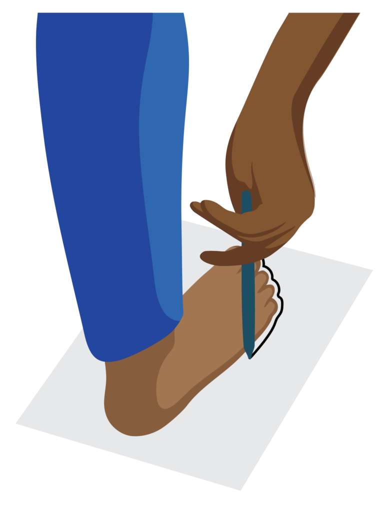 Close view of person standing on paper. The line around their foot can be seen clearly.