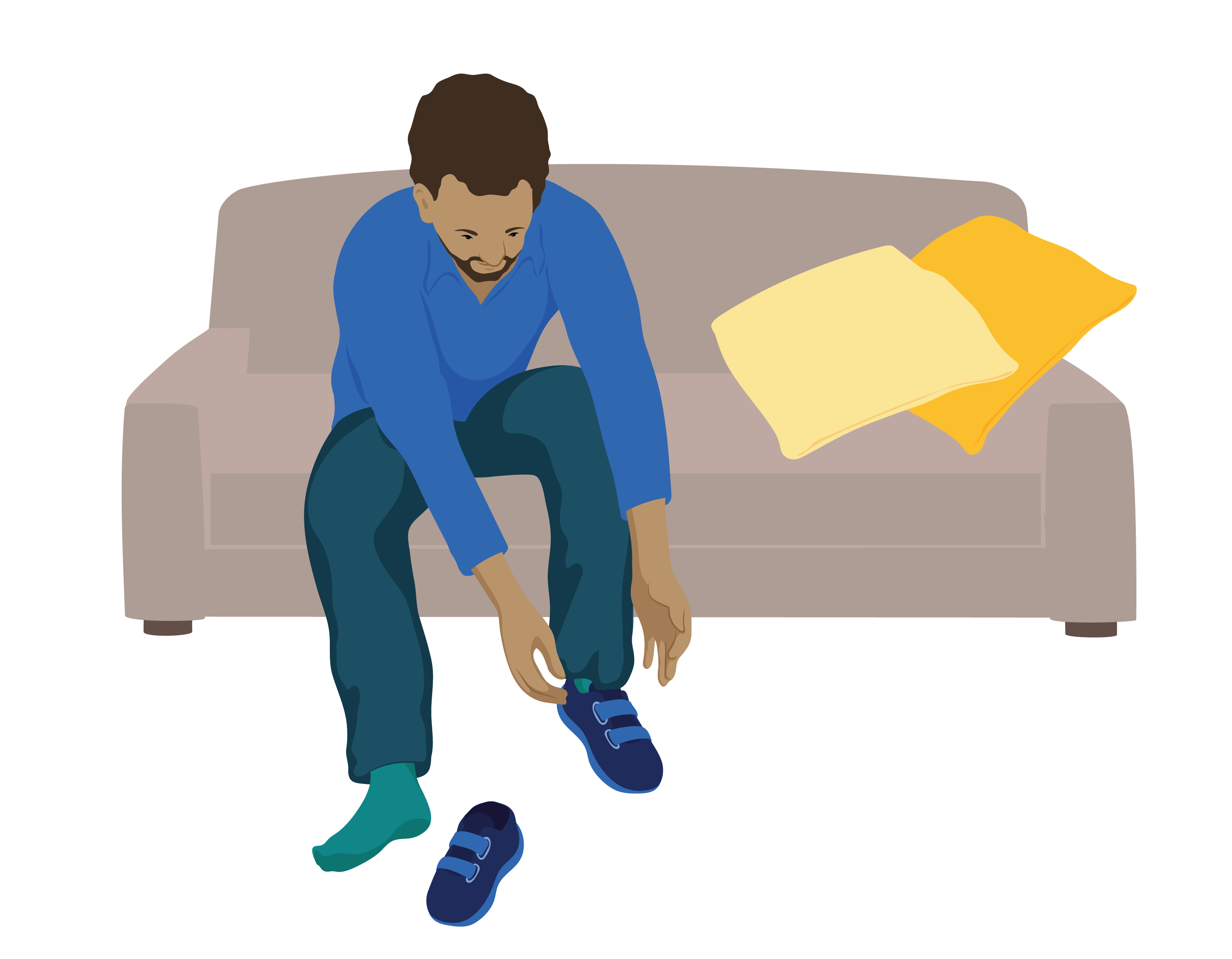 Man sits on sofa to put on his therapeutic footwear.