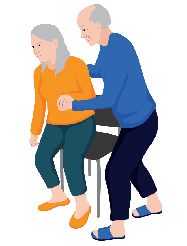 Verna, an older woman, is assisted to stand up from a chair by her husband.