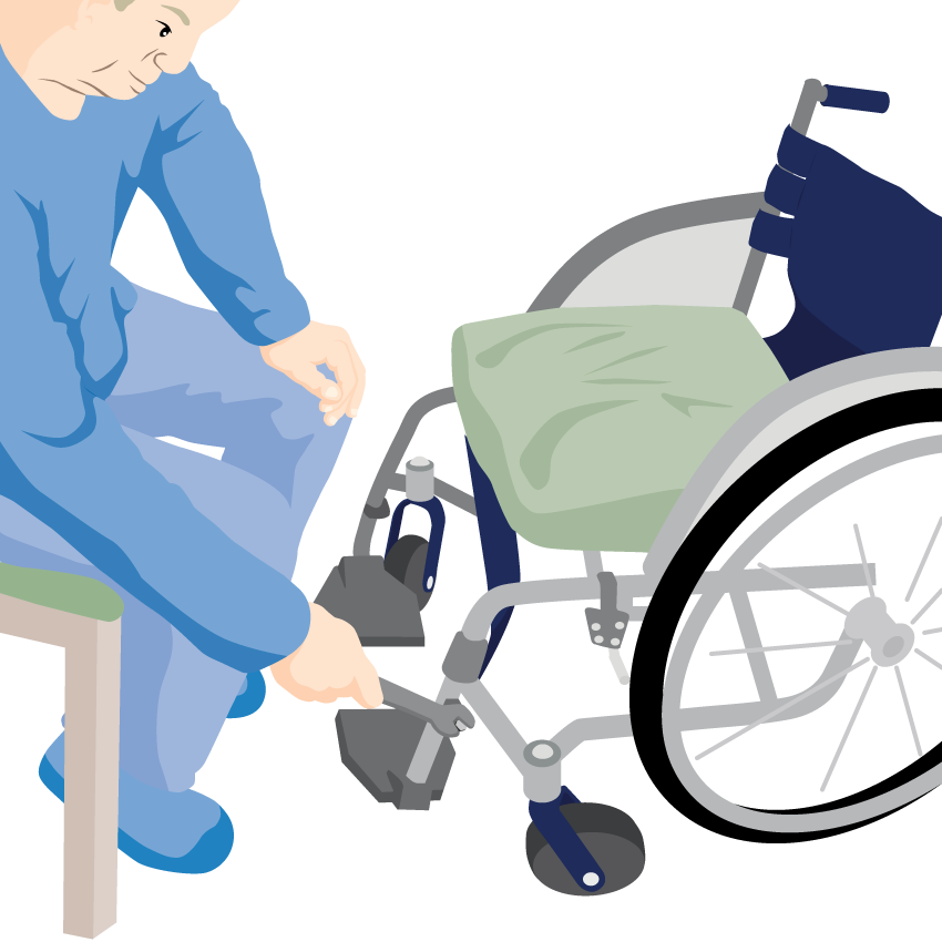 A person sits on a chair facing their wheelchair using a tool to check nuts and bolts.