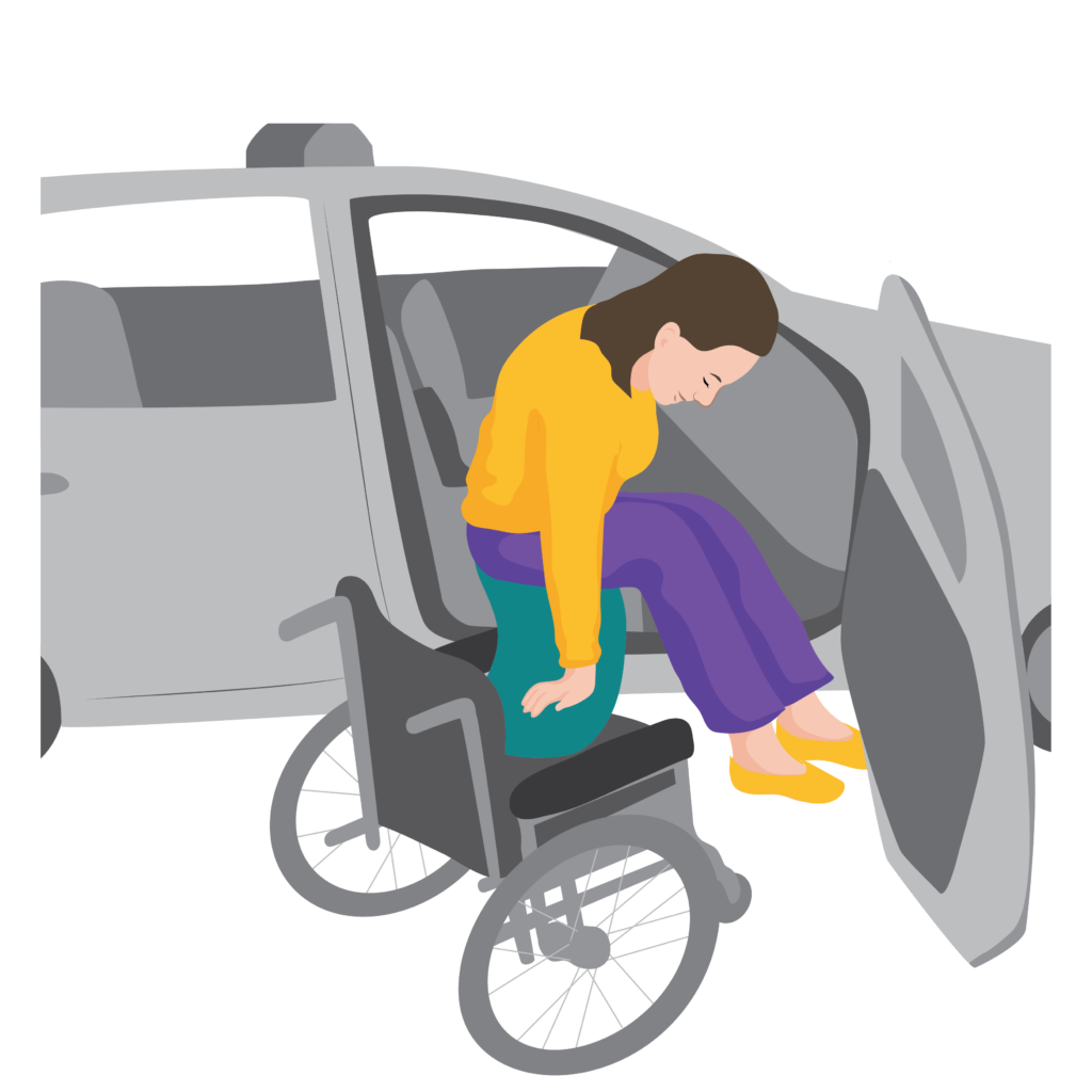 A person uses a transfer board to move from their wheelchair to a car. The board is positioned between the wheelchair cushion and car seat.